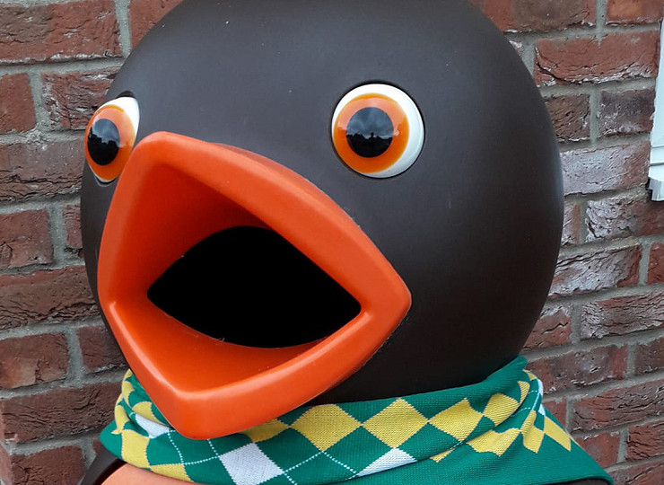 Chomp the chocolate orange bird bin revealed to be a Norwich City supporter!